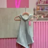 WhatsApp Image 2026-04-26 at 2.01.04 PM Blusa de Strass con Espalda Descubierta y Cuello Alto – Plata